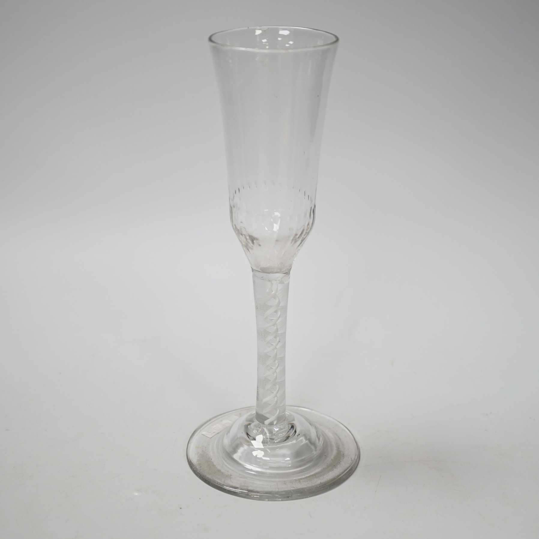 An English lead crystal ratafia glass, c.1750-60, the bowl is slightly waisted and elongated with an ogee finish and basal moulding, DSOT two spiral tapes inside rare eleven ply thread, domed foot, tool marked bowl and r